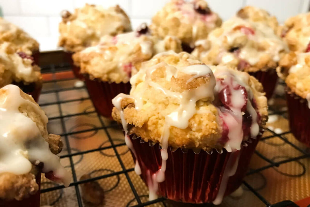 Clementine-Glazed-Cranberry-Walnut-Muffins on a rack.