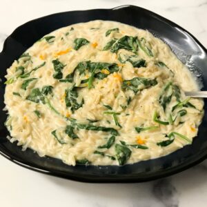 creamy whole wheat orzo with orange and spinach.