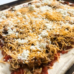 prepared taco pizza ready for oven.