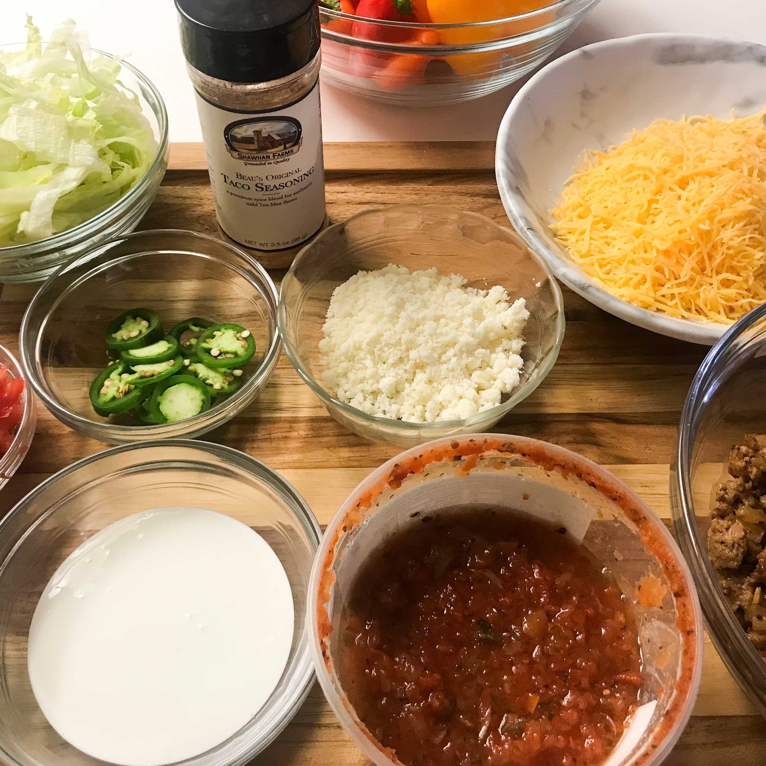 toppings and ingredients for turkey taco pizza.
