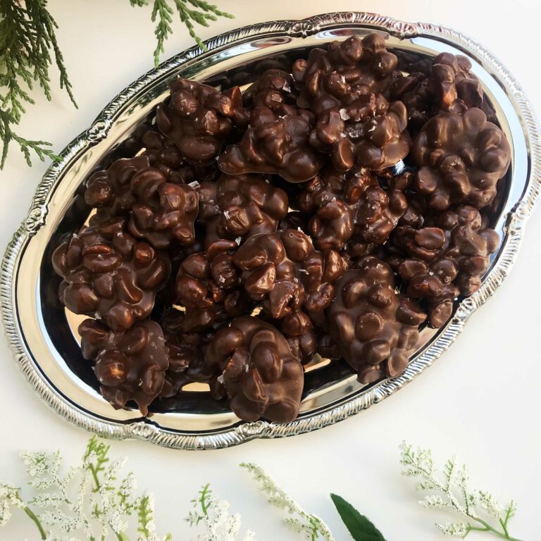 platter of dark chocolate covered macadamia nuts.