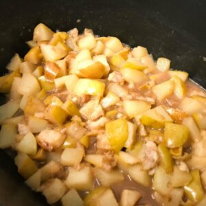 pears cooking in a pot.