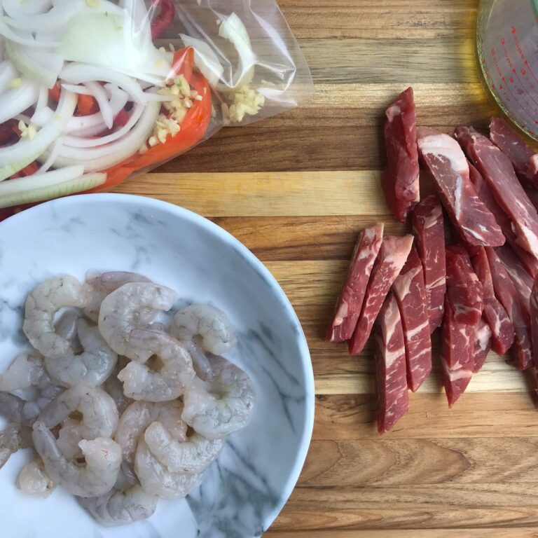 shrimp, sliced steak and veggies for fajitas.
