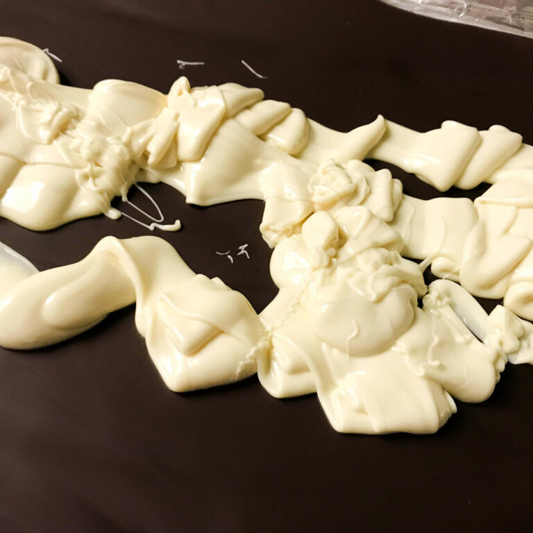 melted white chocolate on top of dark chocolate.