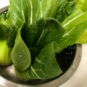 washed bok choy in colanader.