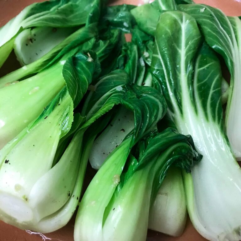 bok choy cooking in skillet.