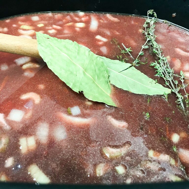 bay leaves and thyme in braising liquid.