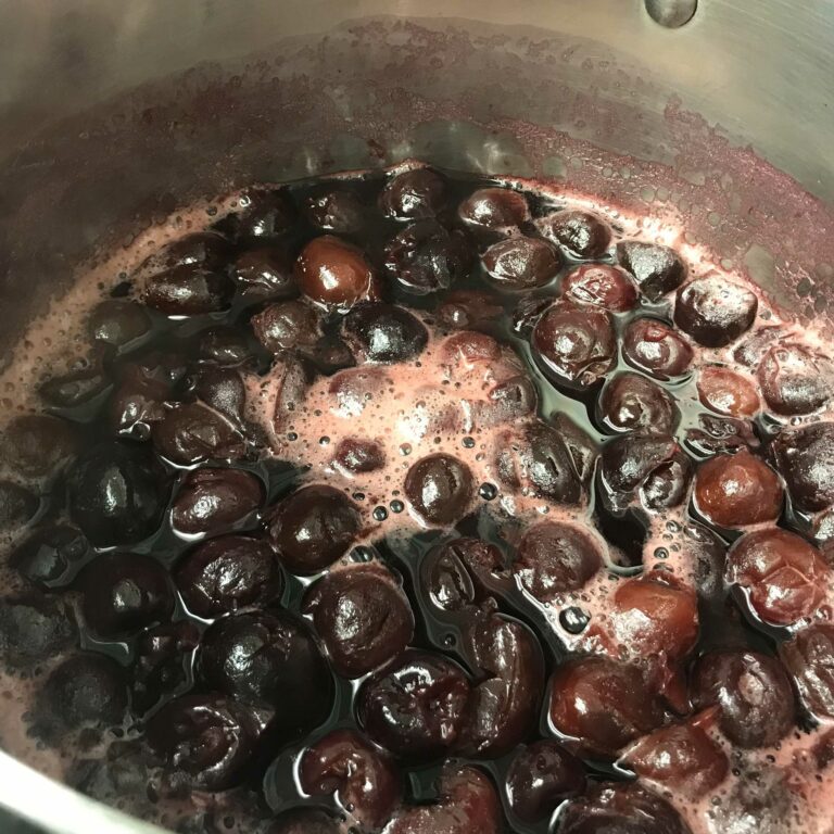 cherry boiling in a pot.
