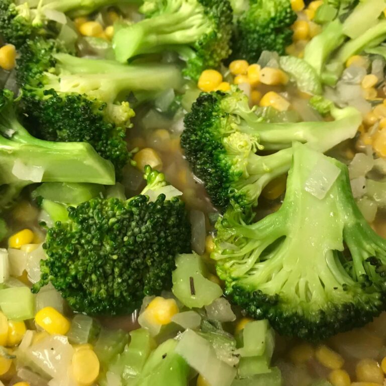 broccoli, onions and corn in a skillet.