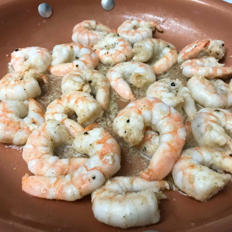 shrimp cooking in skillet.