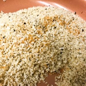 breadcrumbs toasting in skillet.