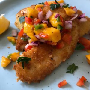 plated crispy fish with salsa.