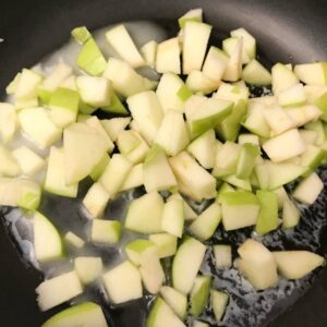 apples cooking in skillet.