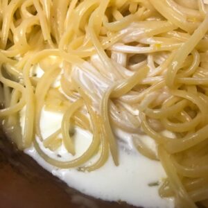 pasta and cream in skillet.