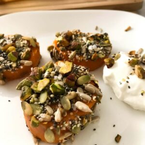 nut and sweet potato rounds on a plate.