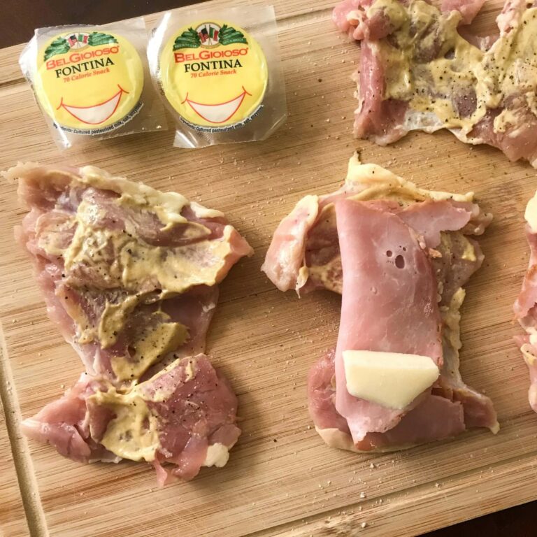 ham and cheese on top of chicken thighs.