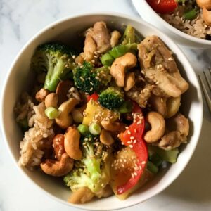 bowl of pineapple and mango chicken stir fry.