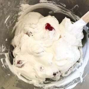 raspberries mixed into cream.