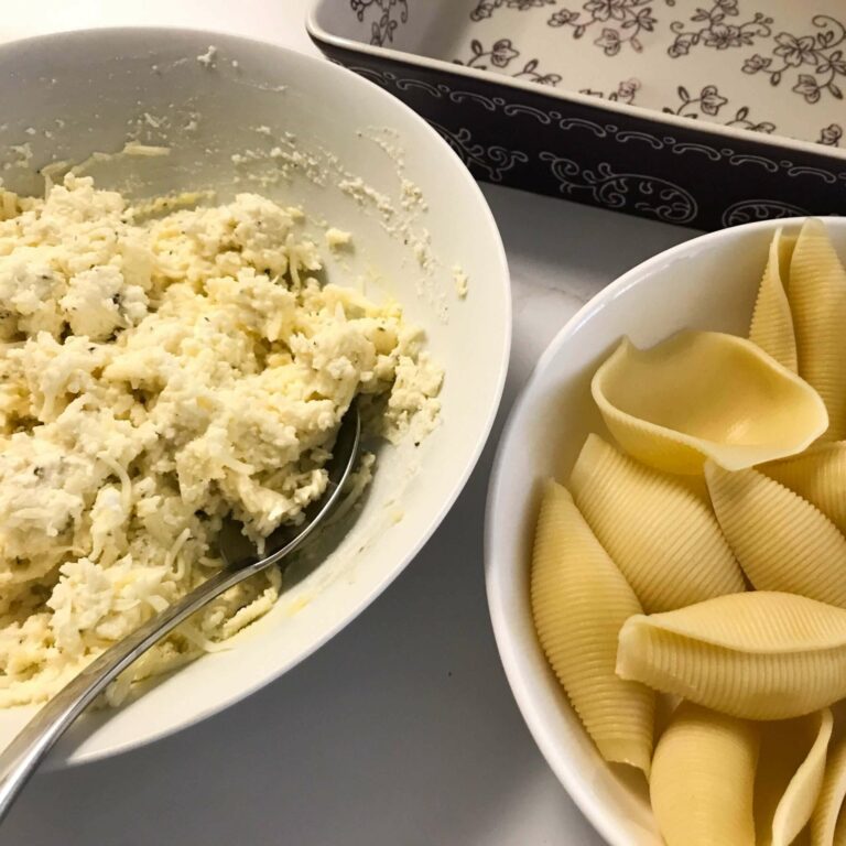 bowl of filling next to bowl of cooked shells.