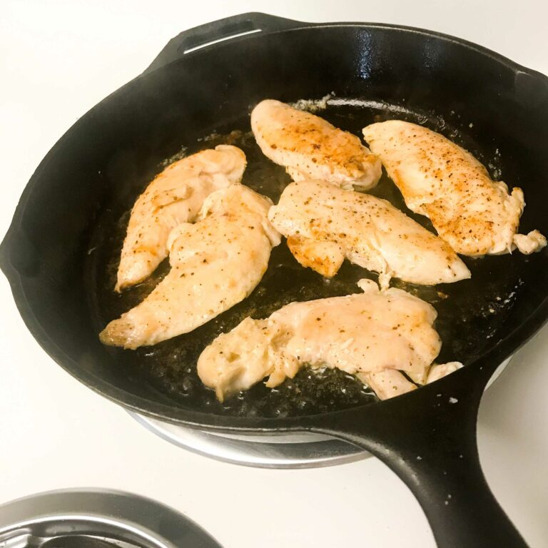 cooked chicken tenders in skillet.