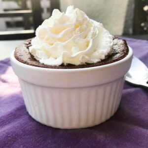 individual chocolate ramekin with whipped cream.