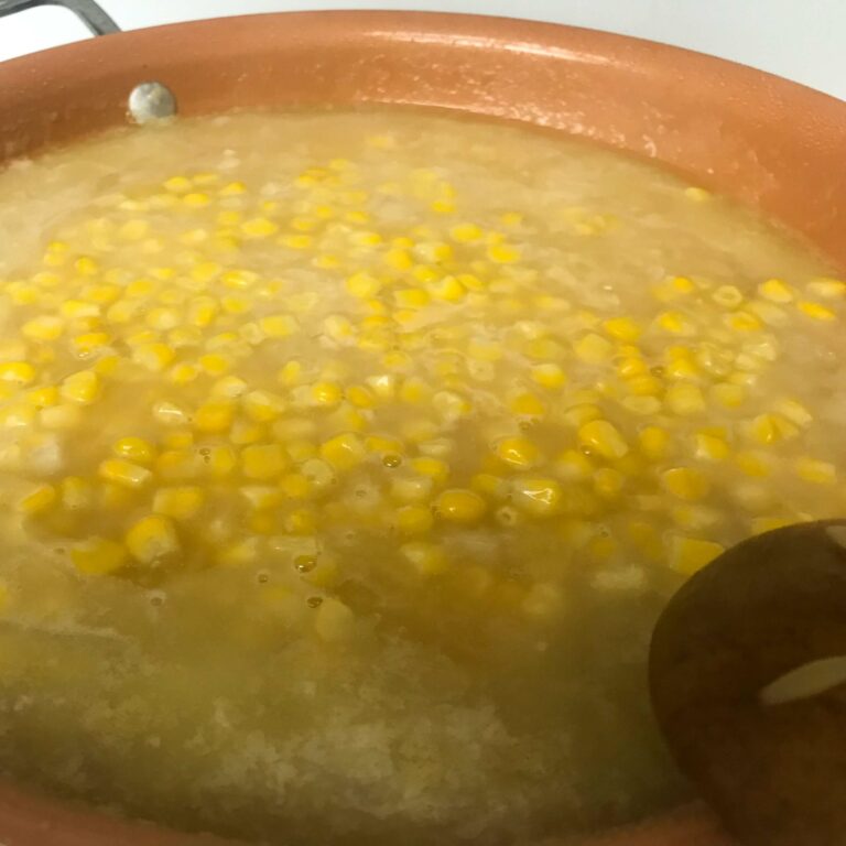corn in simmering broth.
