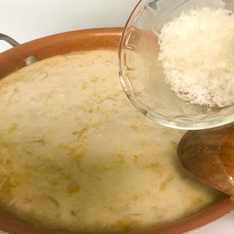adding cheese to broth.