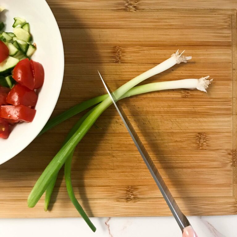 green onions being sliced.
