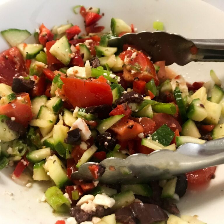 mixed Greek salad in a bowl.