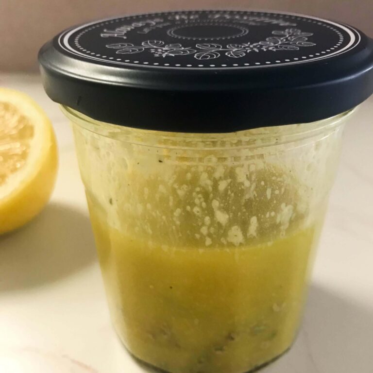 jar of lemon and thyme vinaigrette dressing.