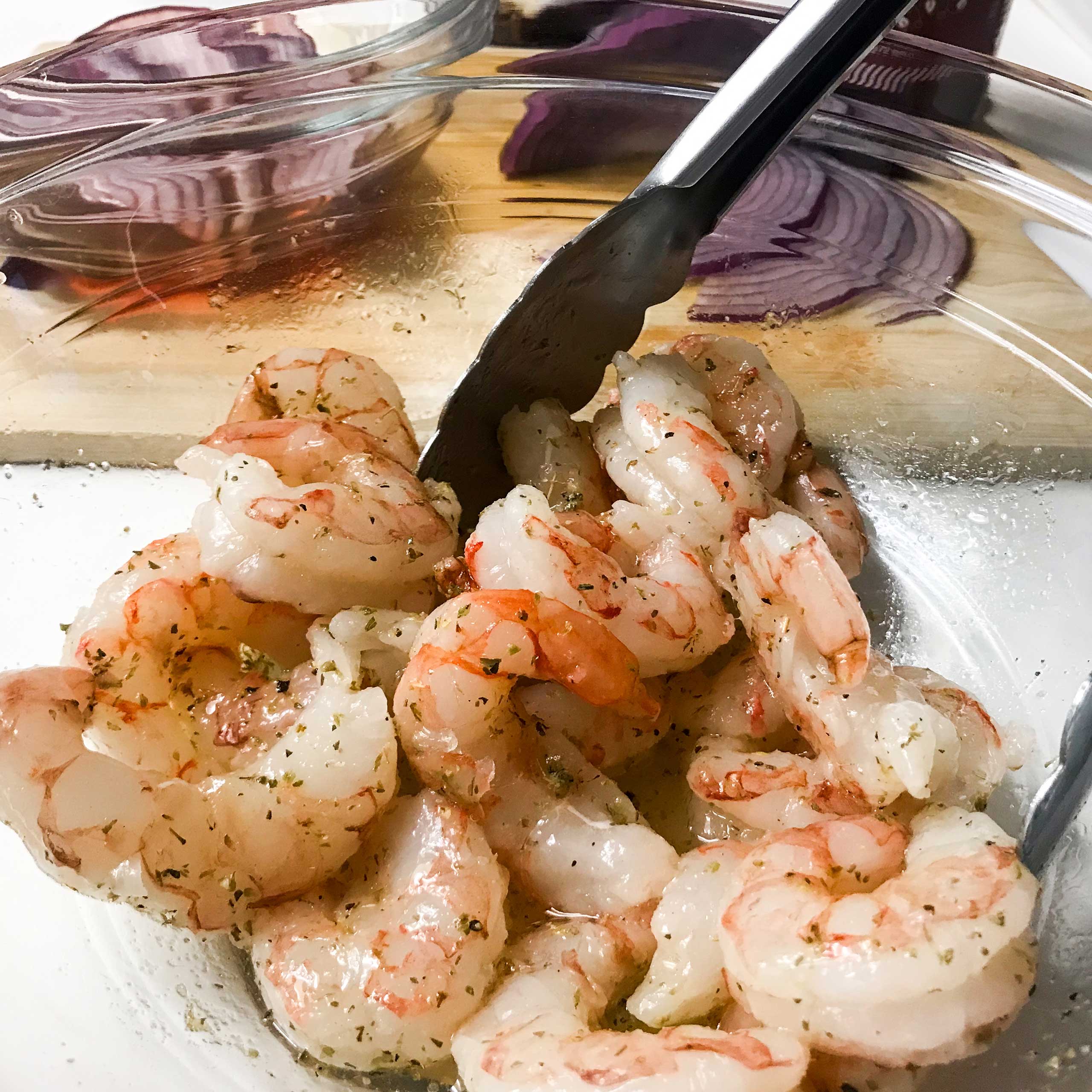 shrimp marinating in a bowl.