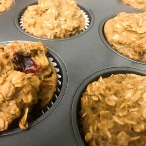 Peanut Butter and Jelly Oatmeal Muffins baked in a pan.