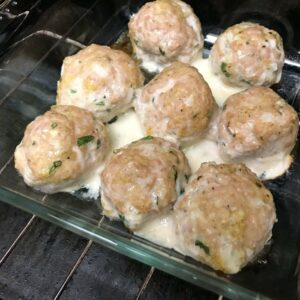 meatballs cooking in oven.