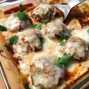 finished meatballs topped with parsley.