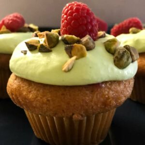 Vanilla Cupcakes with Raspberry Filling and Pistachio Whipped Cream