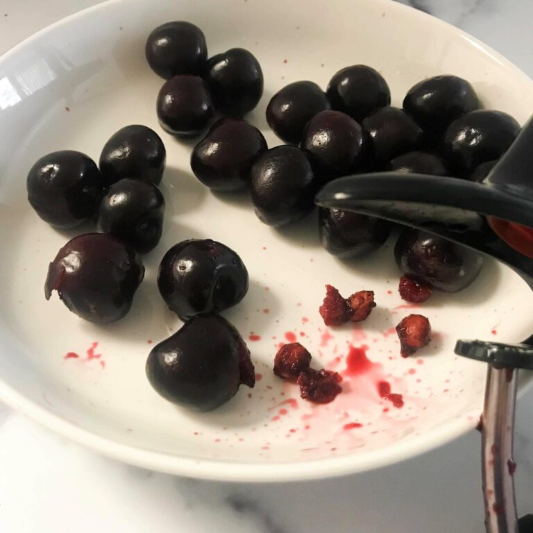 pitted cherries in a bowl.