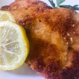 Classic German Pork Schnitzel with lemon wheels.