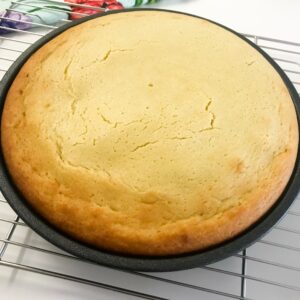 baked cake cooling on a rack.