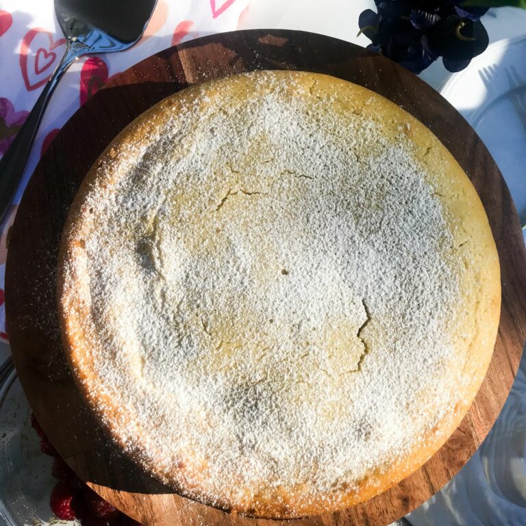 Lemon Olive Oil Cake topped with powdered sugar.