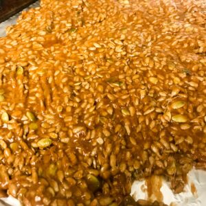 Sunflower Seed Brittle poured onto baking sheet.