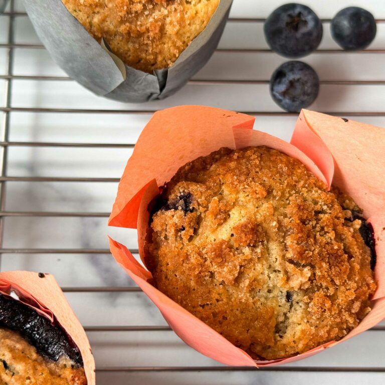 blueberry streusel muffin on a rack.