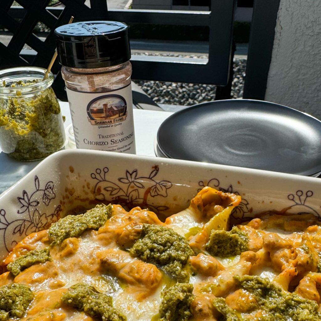 chorizo and pumpkin stuffed shells in a casserole dish.
