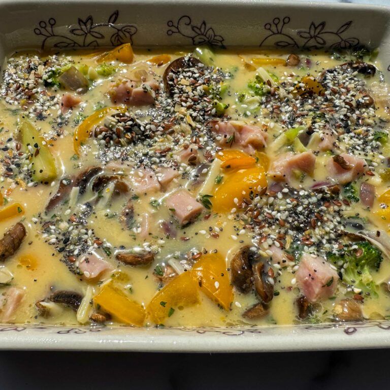 egg, veggie, ham and cheese casserole ready for the oven.