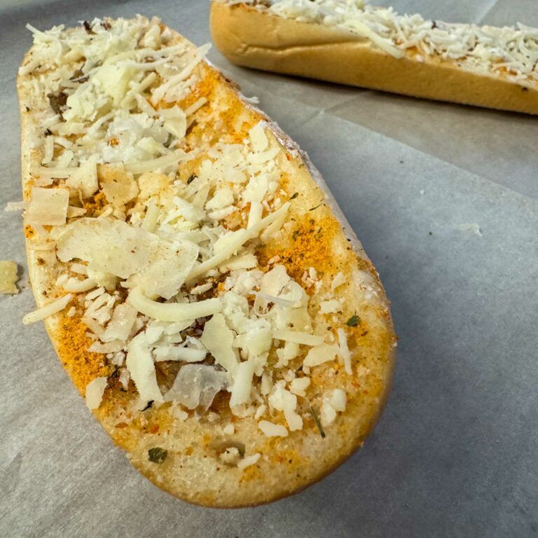 cheese topped bread ready for oven.