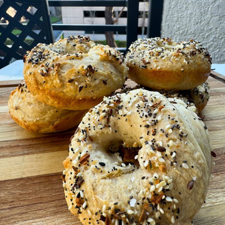 Skinny Everything Bagels stacked on serving board.