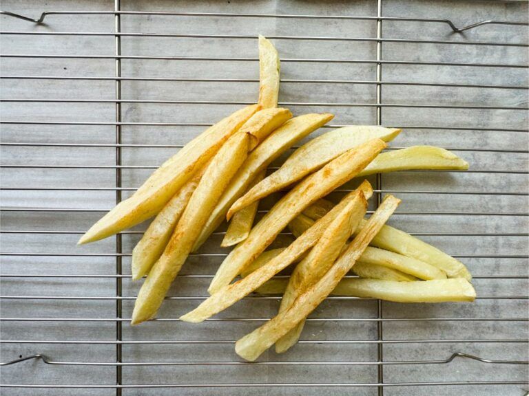 fries after first fry on a rack.