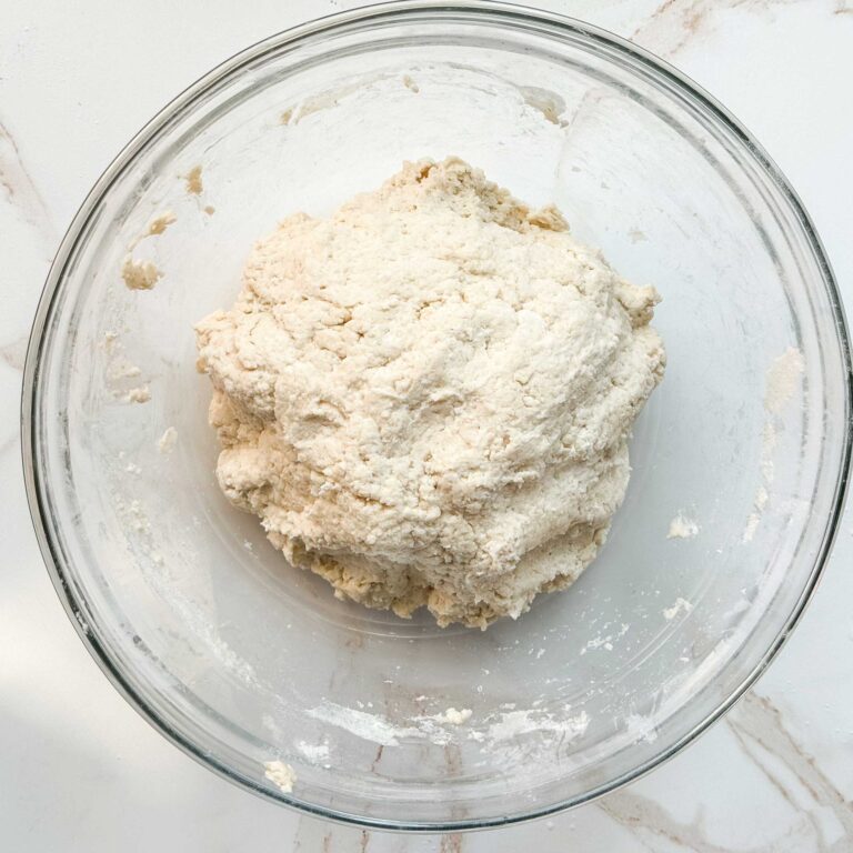 dough roughly shaped in a bowl before rising.