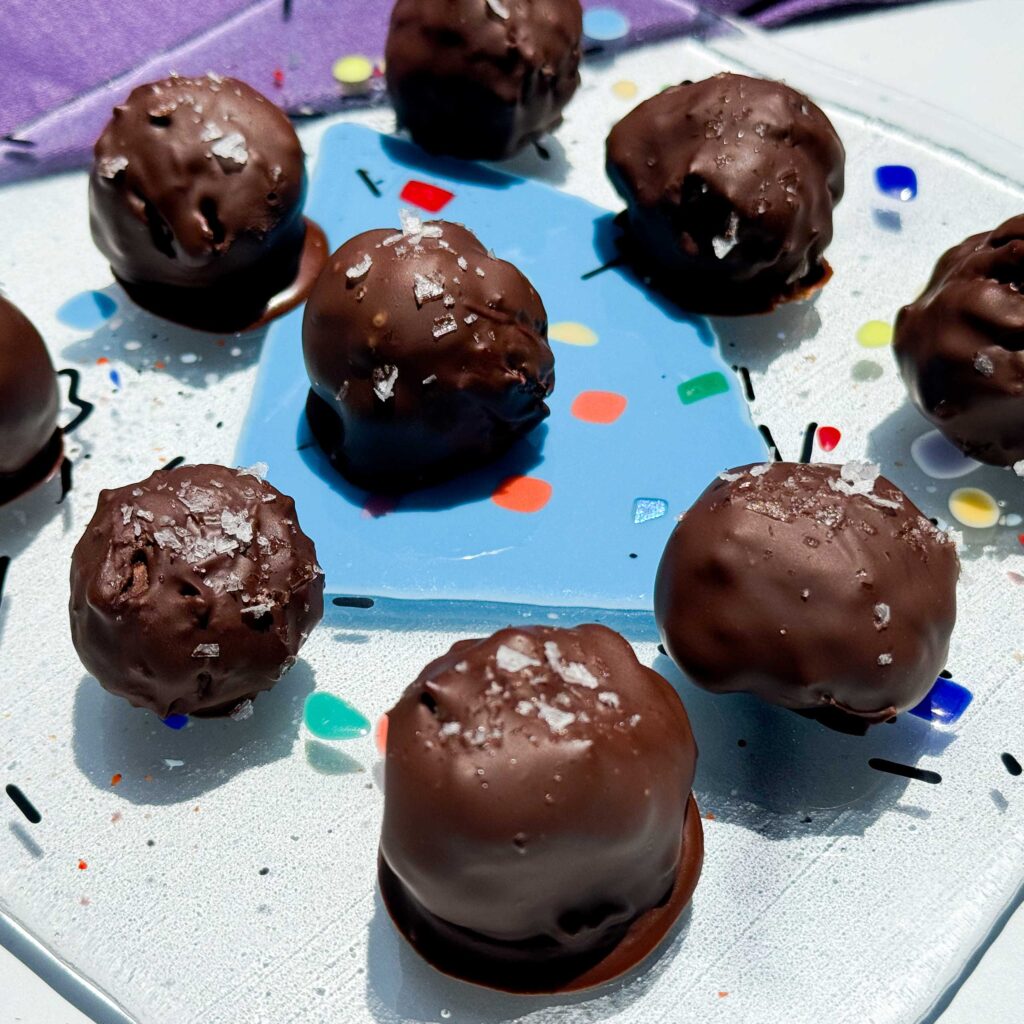sugar free chocolate protein truffles on a platter.