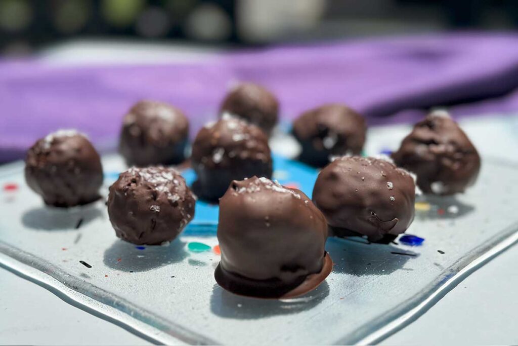 sugar free chocolate protein truffles on a platter.