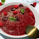 cherry, acai, pomegranate & raspberry smoothie bowl with all the toppings.